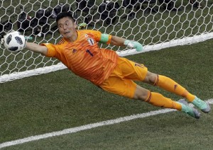 Japan goalkeeper Eiji Kawashima dives to stop a shot right over the goal line during the group H match between Japan and Poland at the 2018 soccer World Cup at the Volgograd Arena in Volgograd, Russia, Thursday, June 28, 2018. (AP Photo/Themba Hadebe)